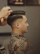 Clean fade haircut from the supplied reference
